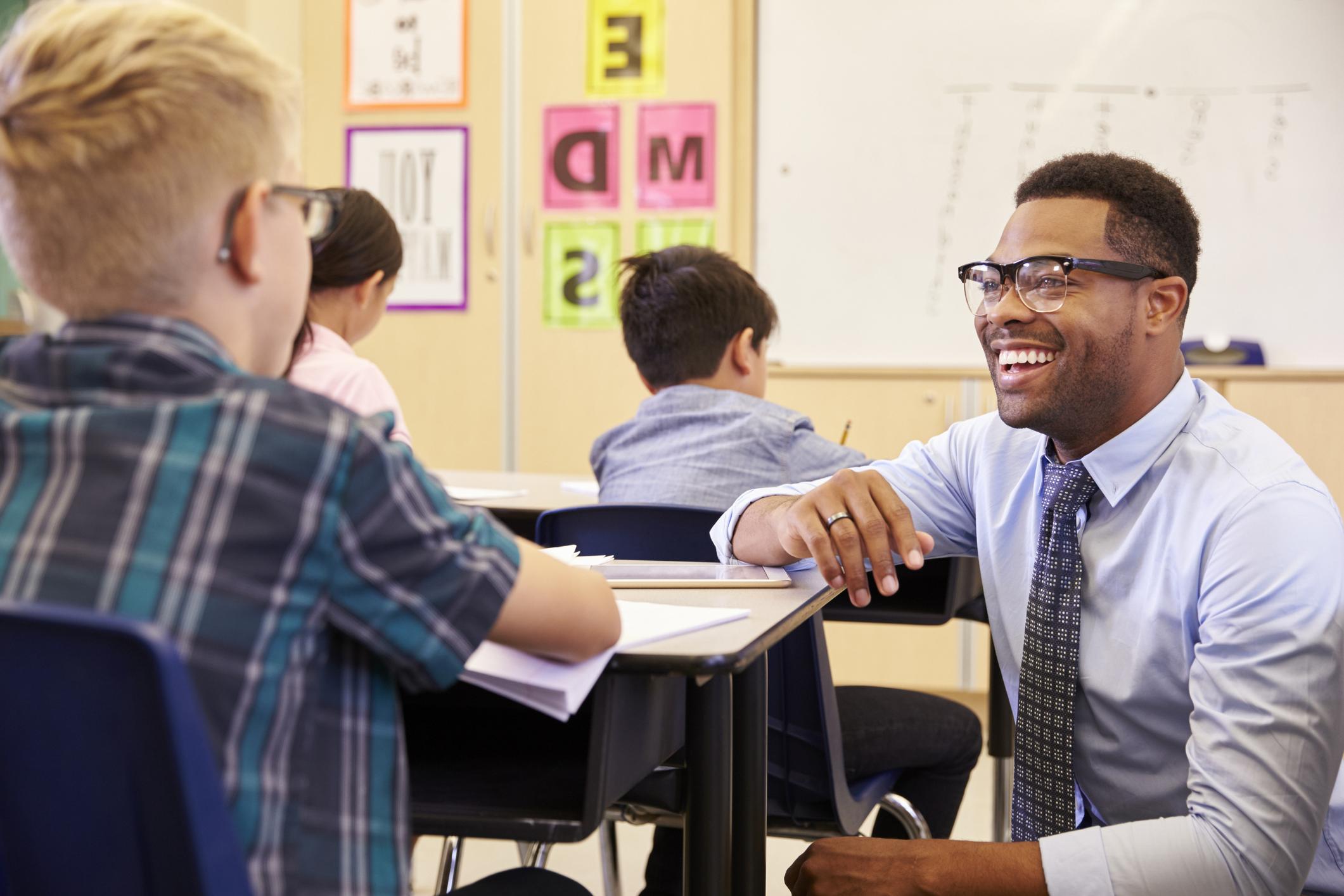 teacher talking to student